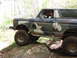 1979 Ford Bronco - This lifted Ford Bronco is shown off-roading on a rocky trail.