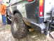 1979 Ford Bronco - This truck features a camouflage paint job and is equipped for off-road use with large tires and a heavy-duty bumper.