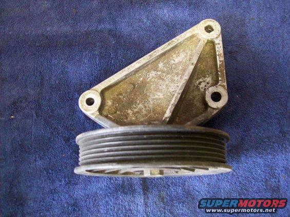 pulley bracket with ribbed pulley attached, on blue cloth background