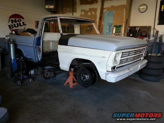 1967 Ford F-100 truck, front end on jack stands, undergoing repairs