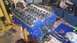 1973 Ford Torino - A blue V8 engine, likely undergoing a rebuild, is shown on an engine stand with tools nearby.