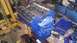 1973 Ford Torino - A blue V8 engine block is mounted on an engine stand, surrounded by tools and parts in a workshop setting.