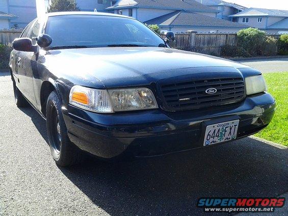 Front view of black 2000 Ford Crown Victoria with Oregon license plate 644FXT
