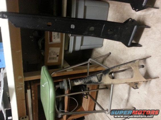 Black and tan vehicle suspension components on a shelf