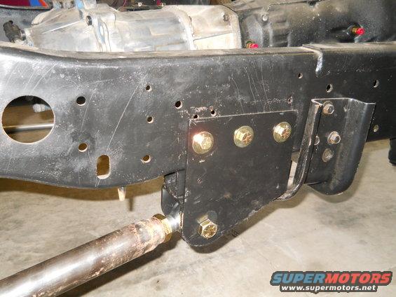 Vehicle frame with transmission and suspension components, close-up view