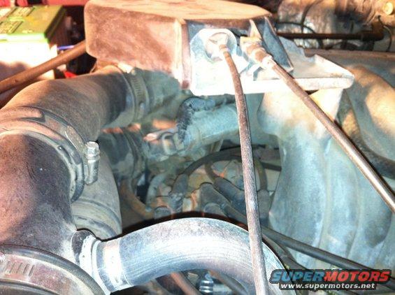 Throttle cable/ valve cover vent to intake.