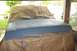 1990 Ford Bronco - The hood and fender of a 1990 Ford Bronco are covered in paper, likely for painting or protection.