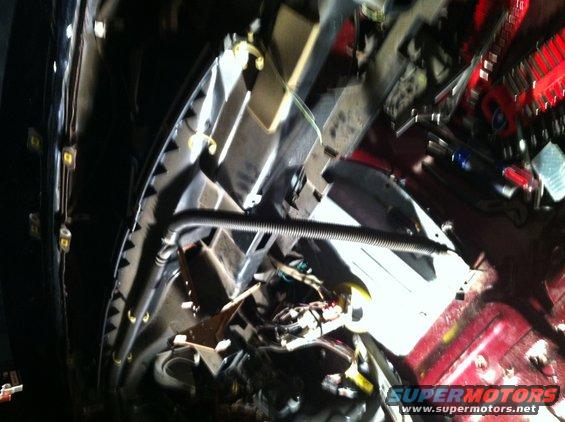 1996 Ford Bronco engine bay with red paint and tools scattered