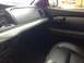 2005 Ford Crown Victoria - The interior of a car is shown, focusing on the dashboard and door panel details.