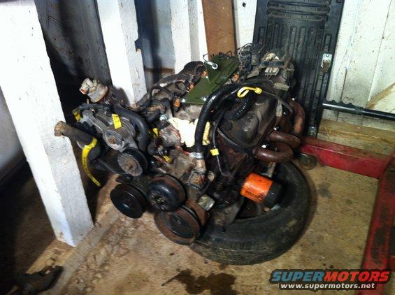 Engine on tire with orange oil filter