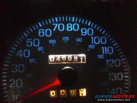 Speedometer showing 0-140 mph with odometer reading 046981. Also shows trip meter reading 009H