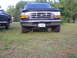 1993 Ford Bronco - Front View, the things hanging under the front are the swaybar mounts that I had to cut and extend.