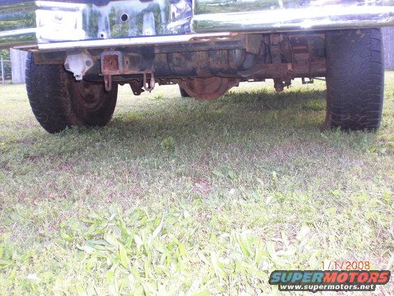 rear axle, hitch, and tires of a truck