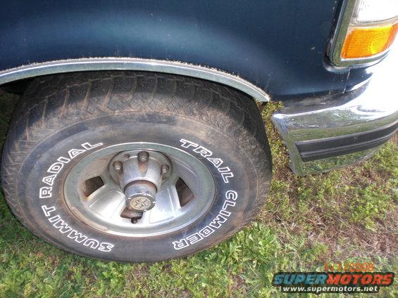 1993 Ford Bronco front wheel with Summit Trail Climber tires and chrome bumper