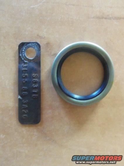 Metal tag with stamped numbers and a circular seal ring