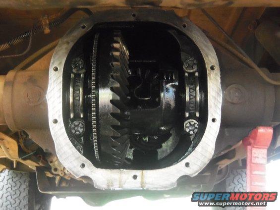 Differential housing with gears visible, undercarriage of a vehicle