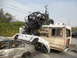 1986 Ford Bronco - A chaotic scene with multiple vehicles involved in what appears to be an accident or stunt.