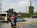 1986 Ford Bronco - A chaotic scene with an off-road buggy perched atop a bus, a wrecked car, and caution tape.
