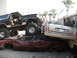 1986 Ford Bronco - A heavily modified 1986 Ford Bronco is perched atop a pile of wrecked vehicles.