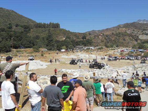 Off-road vehicles and spectators at an outdoor event