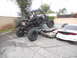 1986 Ford Bronco - A heavily modified off-road buggy is perched atop several crushed vehicles, suggesting a scene of destruction or a car crush event.