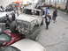 1986 Ford Bronco - This heavily modified truck, likely from the late 1970s or early 1980s, is covered in mud and parked on top of other vehicles.