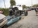 1986 Ford Bronco - A lifted monster truck is shown crushing a sedan, with other vehicles lined up in the background.