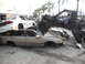 1986 Ford Bronco - A custom off-road buggy is positioned precariously on top of a stack of damaged vehicles.