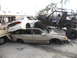 1986 Ford Bronco - A chaotic scene shows multiple damaged vehicles, including a custom off-road buggy, piled together.