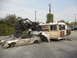 1986 Ford Bronco - A scene of destruction with a buggy perched atop wrecked sedans and a bus.