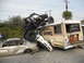 1986 Ford Bronco - A chaotic scene with a bus, a buggy, and multiple crushed cars.