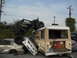 1986 Ford Bronco - A chaotic scene with multiple wrecked vehicles piled up, including an off-road buggy perched atop a bus.