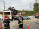 1986 Ford Bronco - A chaotic scene with multiple wrecked vehicles and a bus, some people in Santa hats observe the wreckage.