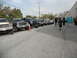 1986 Ford Bronco - Several modified SUVs and trucks are parked in a row on a paved lot.