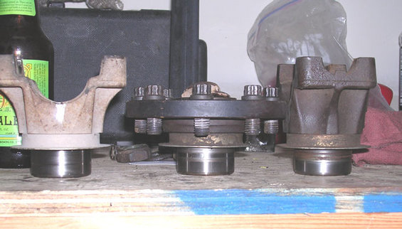 flangeyokecomparo.jpg comparison of fixed yoke to flange splines, etc.  they appear to be the same in every dimensions.  the nice thing is, you can find these in junkyards for cheap.  just bring a 1 1/4 thin wall socket and pull a few.  I went on half off day and got a rear driveshaft for cheap and had the local driveline shop cut it off and put it on my front shaft for a fairly cheap 1330 front cv shaft