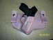 2000 Nissan Xterra - Pink leather gun holster with a black handgun is shown. The image has a date stamp.