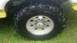 1983 Ford F-250 - This image shows a close-up view of a vehicle's wheel and tire, likely for sale as a part.