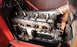 1909 Ford Model T - This image shows the engine compartment of a vintage automobile, focusing on the engine block and its components.