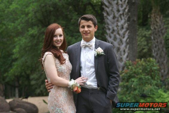 Couple posing for prom photo outdoors