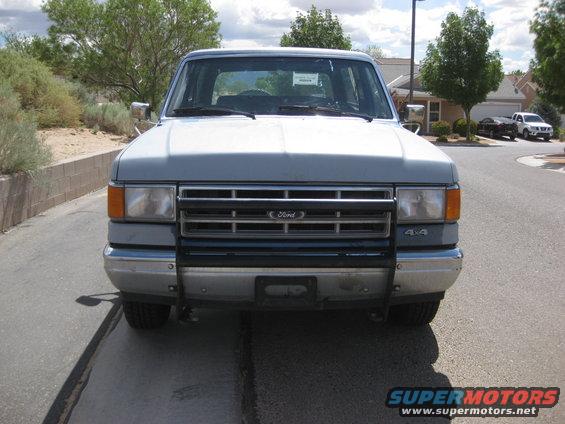 Gray Ford Bronco front view, showing grille and bumper
