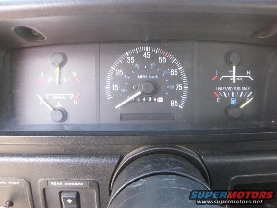 Dashboard gauges showing speed, fuel, and temperature; odometer reads 44999.4