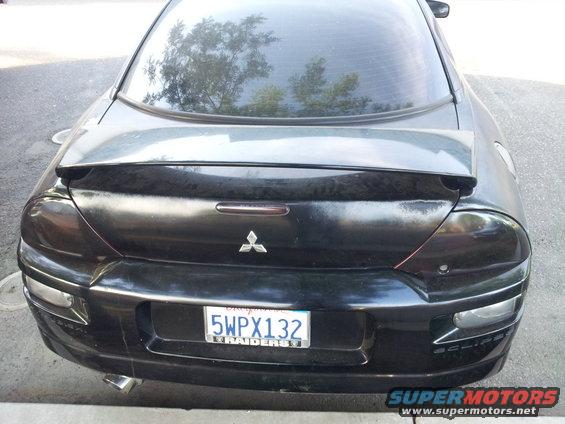 Black 2001 Mitsubishi Eclipse rear view with spoiler and license plate