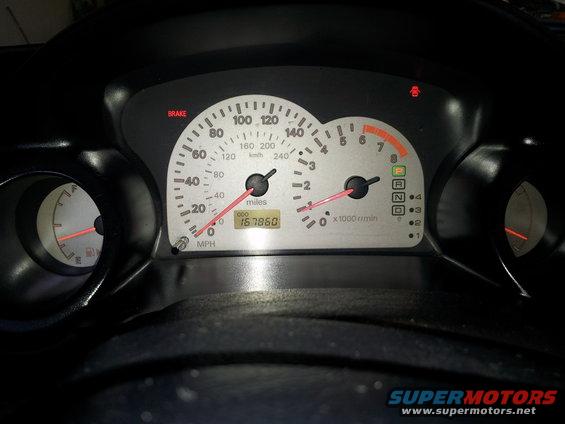 2001 Mitsubishi Eclipse dashboard with odometer showing 167860 miles