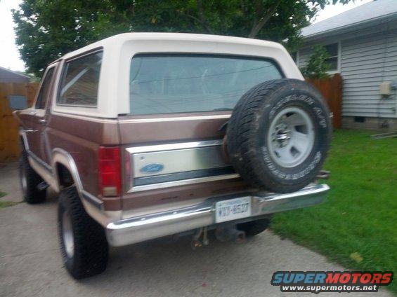 Brown 1982 Ford Bronco rear view with spare tire mounted on tailgate