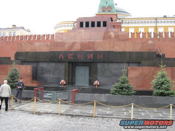 Lenin's Mausoleum in Moscow with trees and a guard