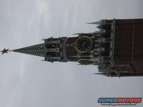 Kremlin clock tower with large clock faces and a star on top