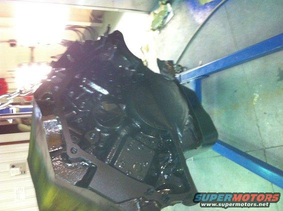 black engine block on a stand, being worked on