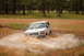 1996 Ford Bronco - 1996 Ford Bronco navigates a challenging muddy water crossing.