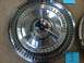 1965 Ford Thunderbird - A single chrome hubcap with the Thunderbird name is shown, not a full vehicle.