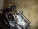 1995 Ford Bronco - The engine of a Harley-Davidson motorcycle is shown in detail, chrome and black components.